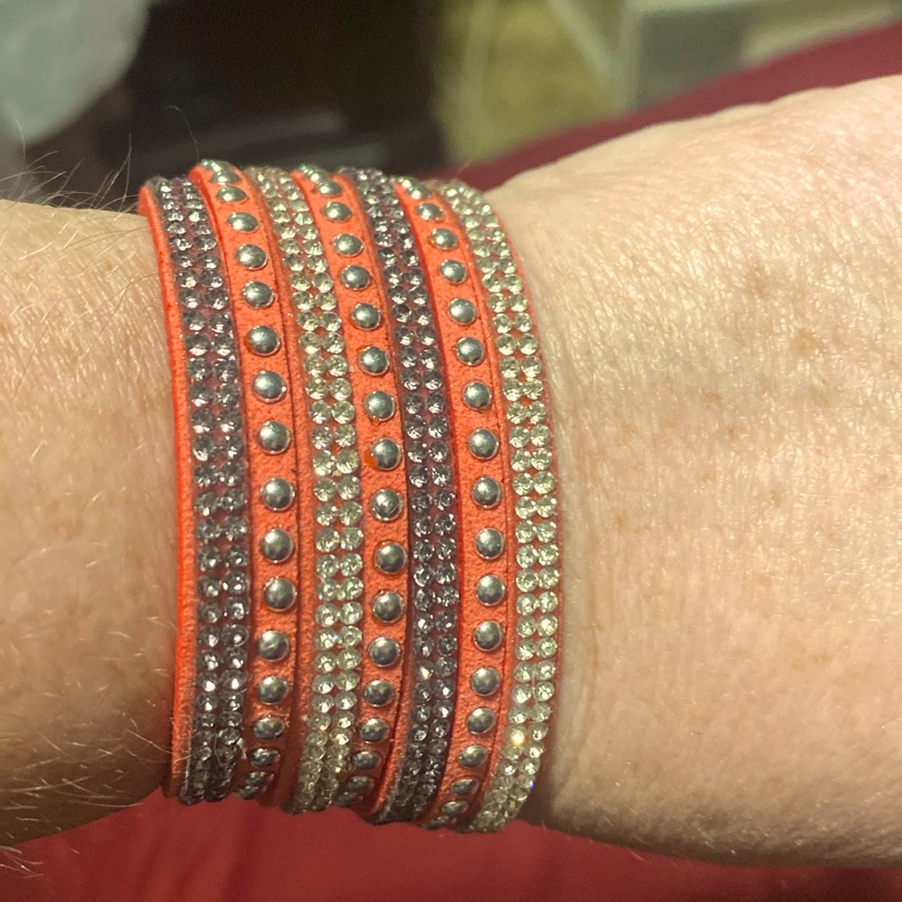 Selling this orange with silver lining cute bracelet
